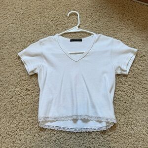 White Lacey v neck brandy top. One size but fits around a small. Great condition
